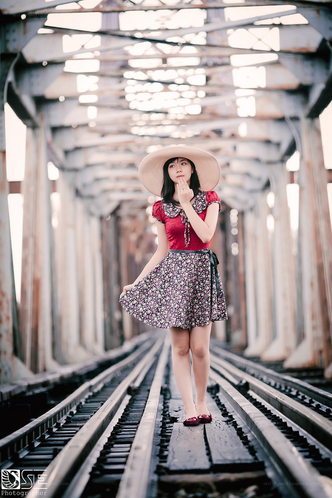 Woman on a train bridge