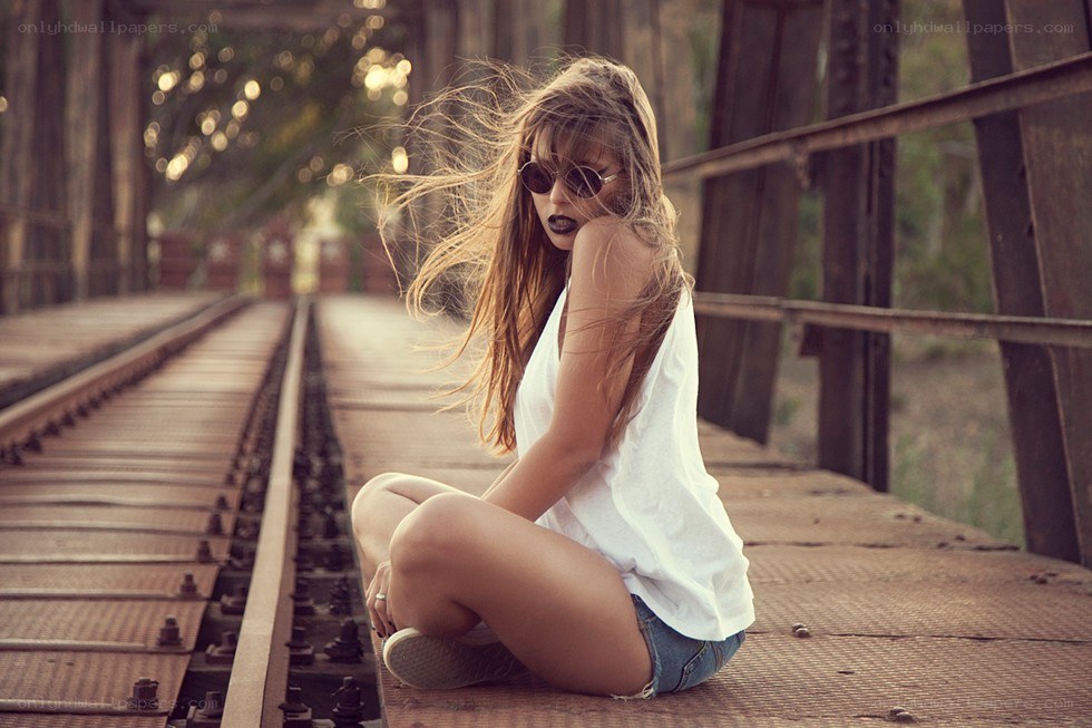 Woman on a train bridge