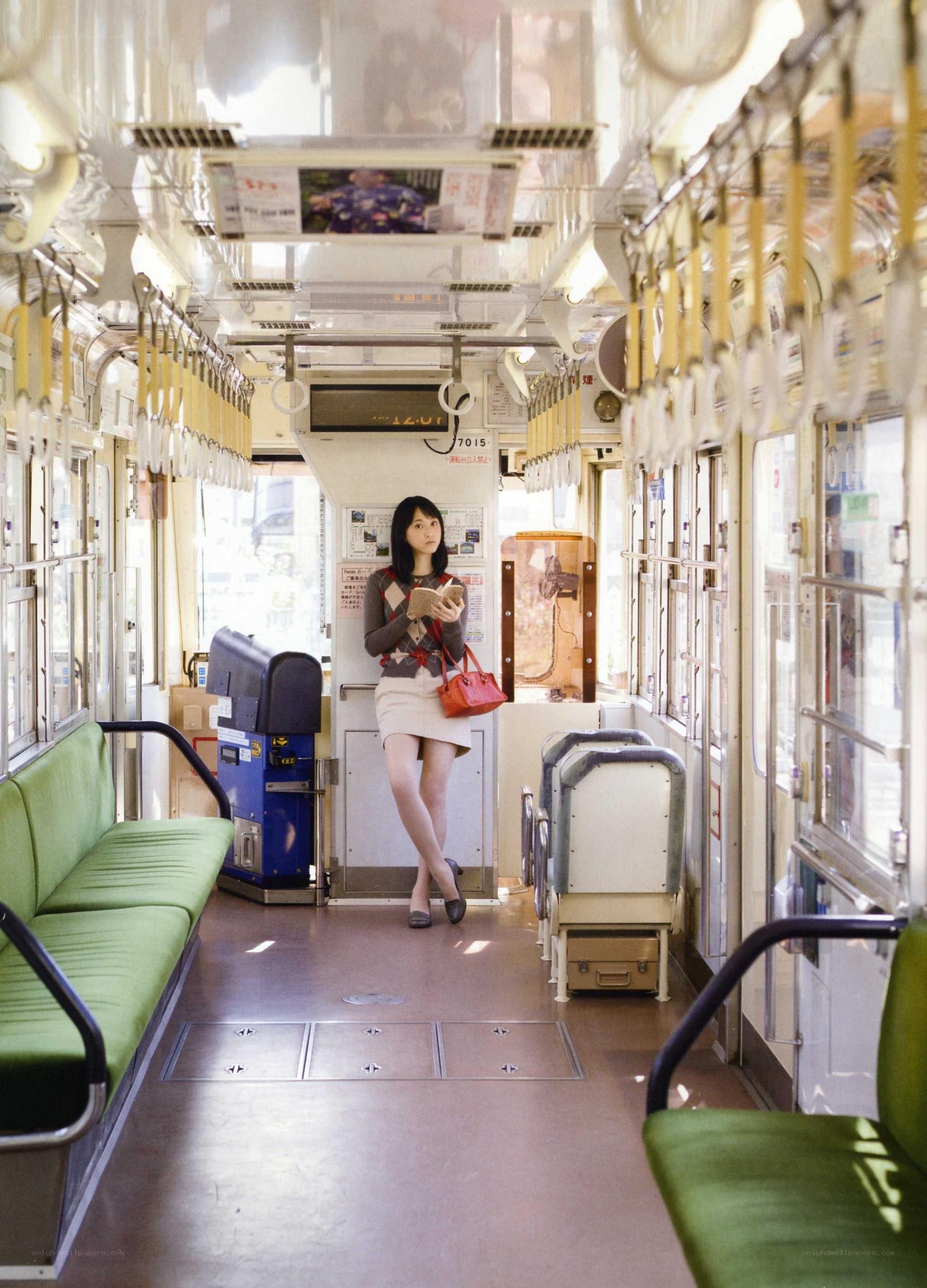 Woman on a train reading