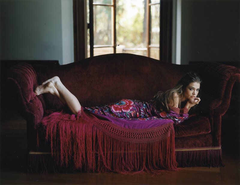 Woman on a velvet couch
