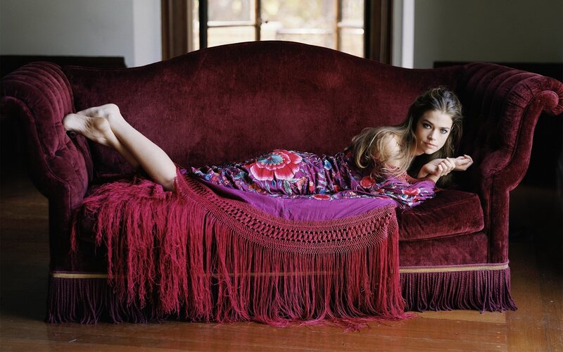 woman on a velvet couch