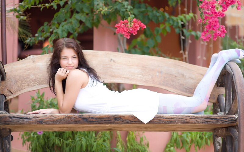 Woman on a wooden bench