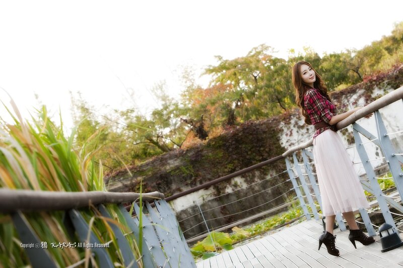 Woman on a wooden bridge