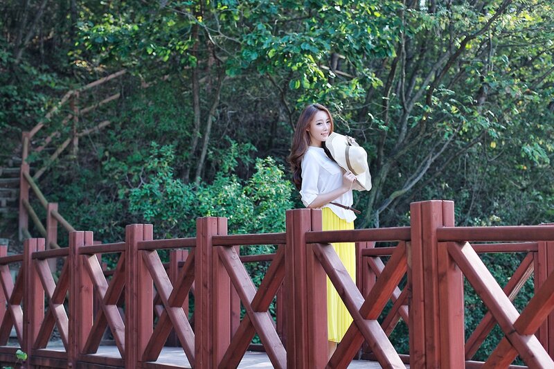 Woman on a wooden bridge