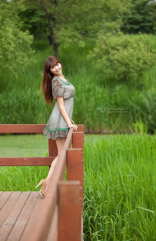 Woman on a wooden bridge