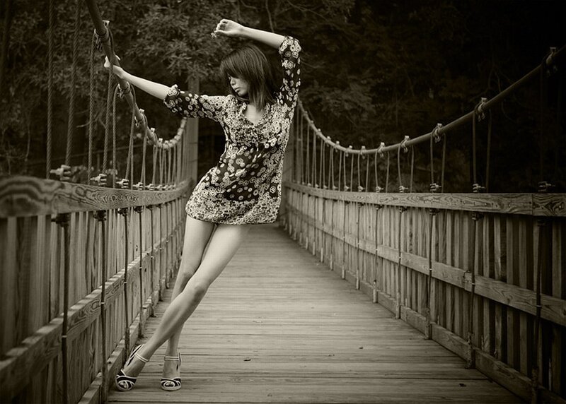 Woman on a wooden bridge