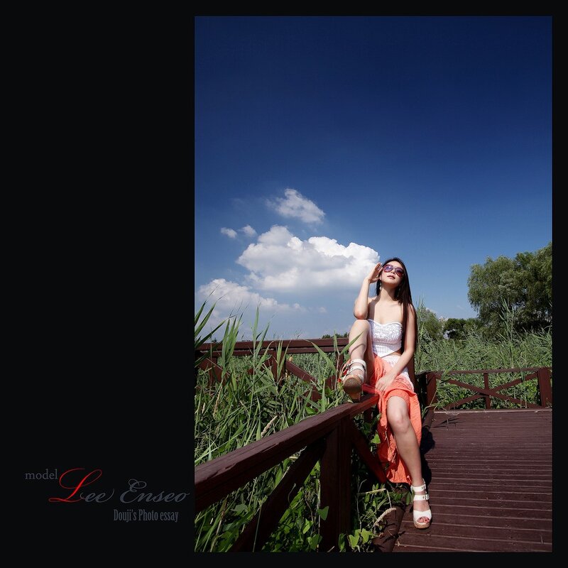 Woman on a wooden bridge