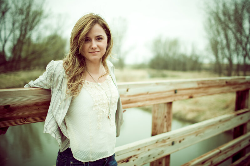 woman on a wooden bridge