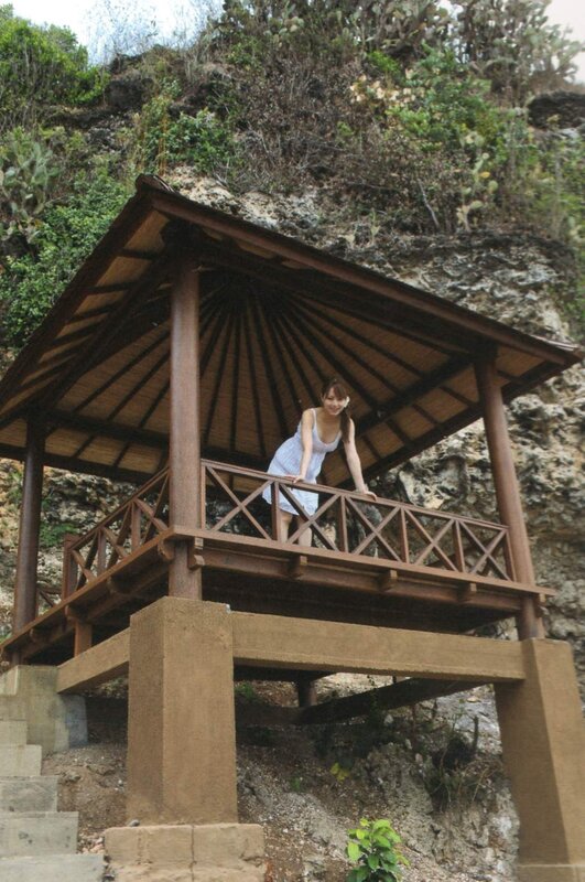 Woman on a wooden gazebo