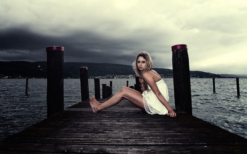 Woman on a wooden pier