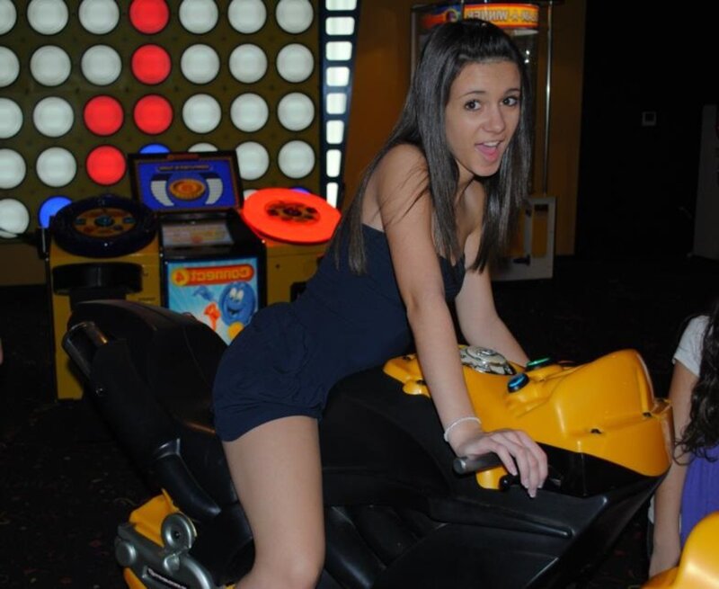 Woman on Arcade Motorcycle