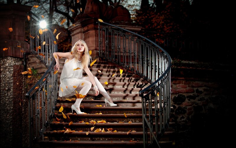 Woman on autumn staircase