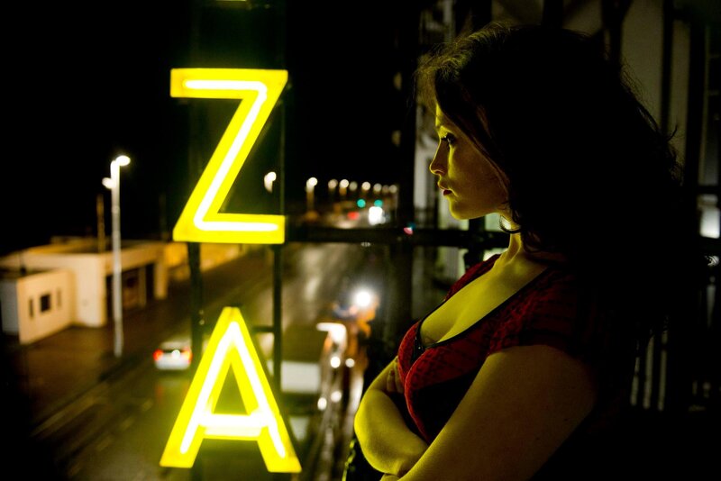 Woman on balcony at night