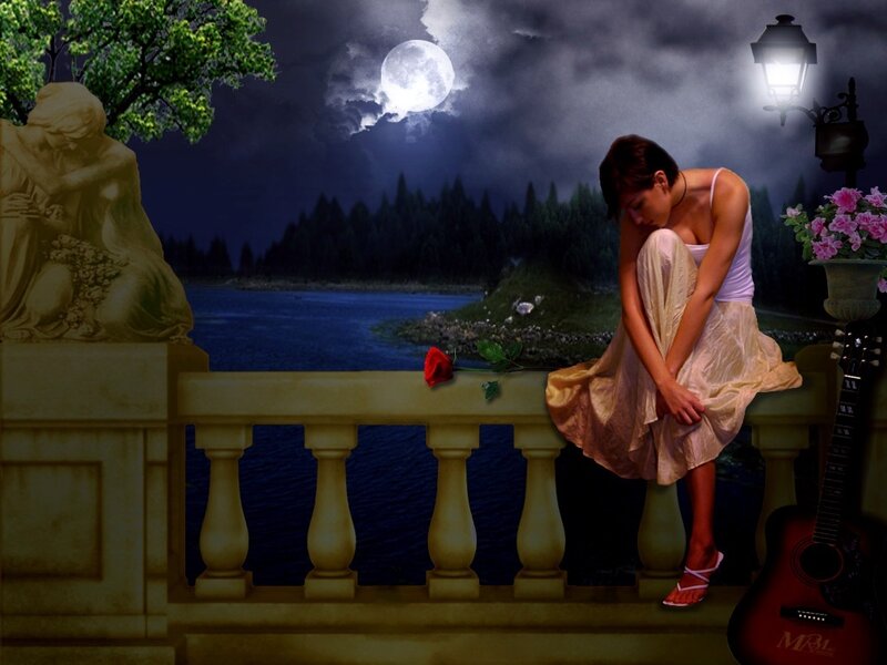 Woman on balcony at night