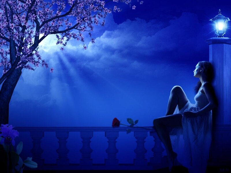 Woman on balcony at night