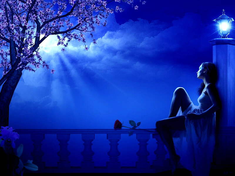 Woman on balcony at night