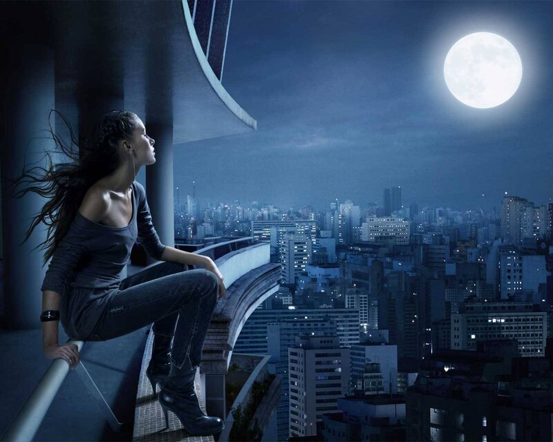Woman on balcony at night
