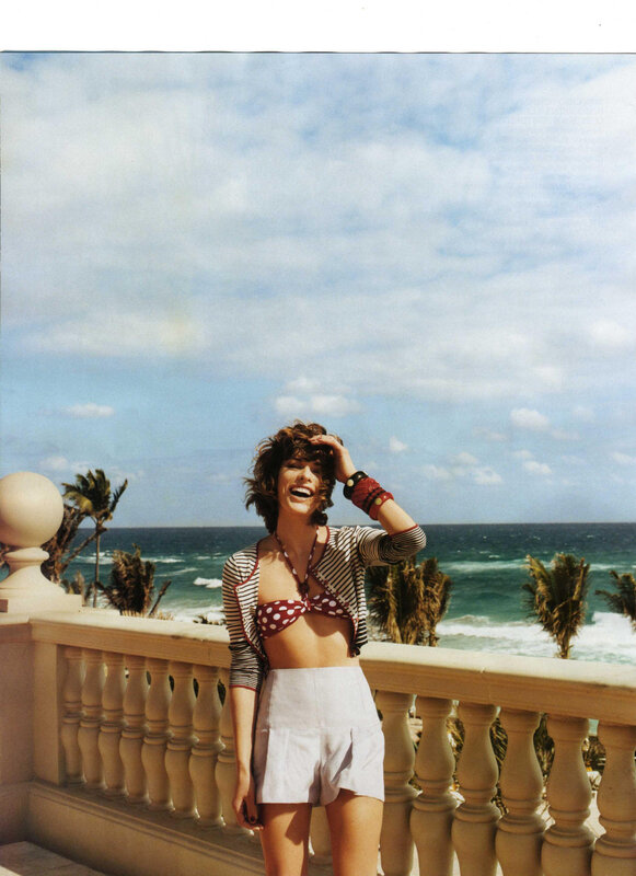 Woman on balcony by the sea
