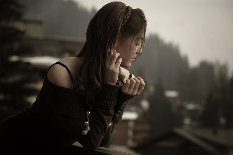woman on balcony in sepia