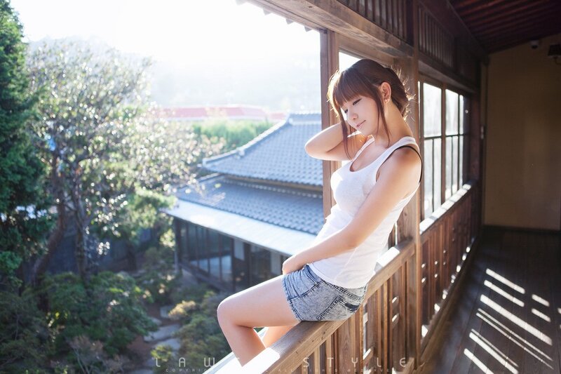 woman on balcony in sunlight