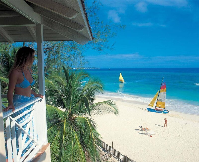 Woman on Balcony Overlooking Beach — Blue