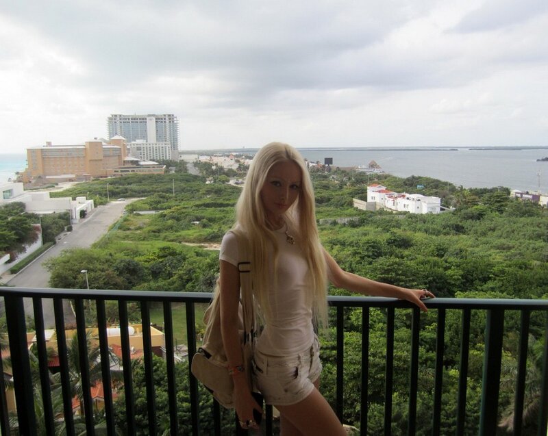 Woman on balcony overlooking resort