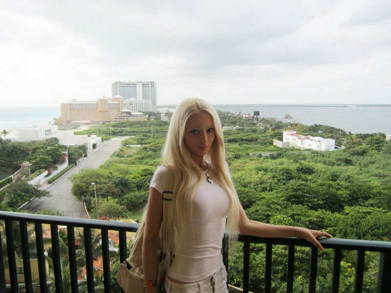 Woman on balcony overlooking resort