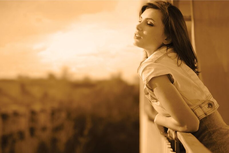 Woman on Balcony — Sepia