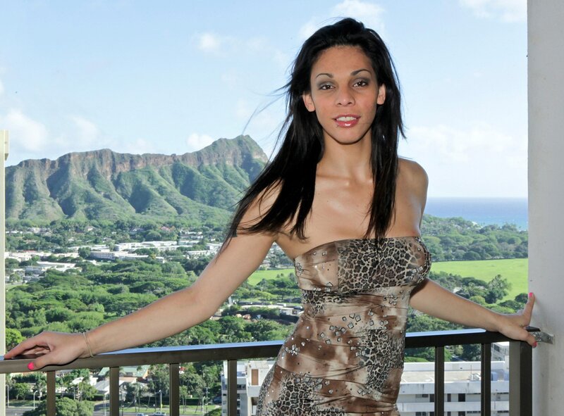 Woman on balcony with mountain view