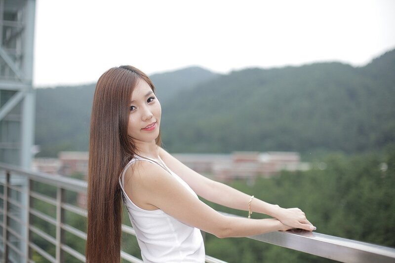 woman on balcony with mountains