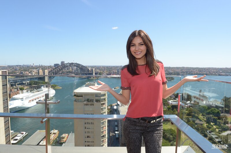 Woman on balcony with Sydney Harbour view