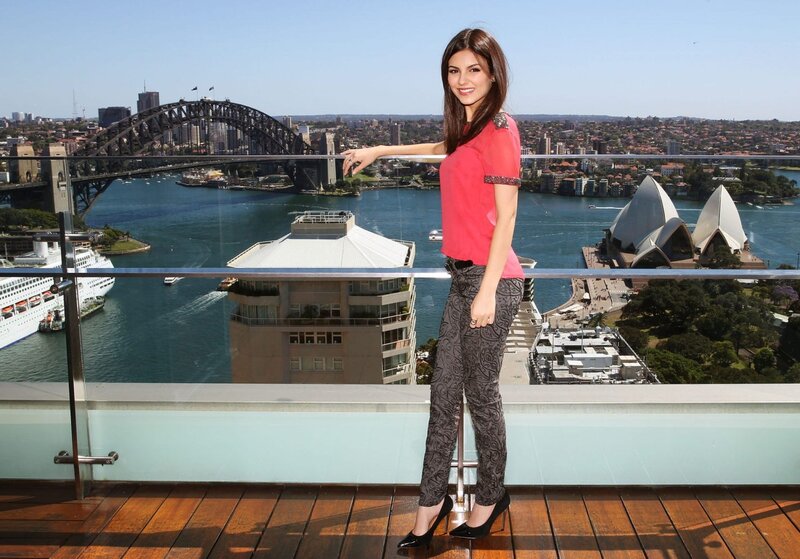 Woman on balcony with Sydney view