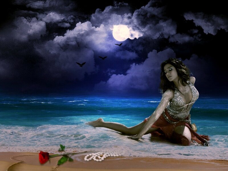 Woman on beach at night