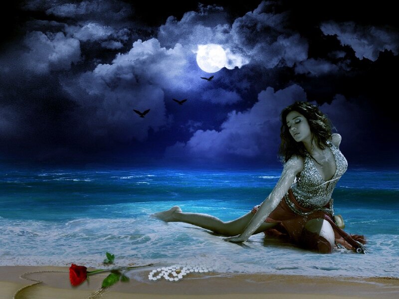Woman on beach at night