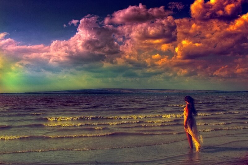 Woman on beach at sunset