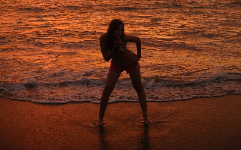 Woman on beach at sunset