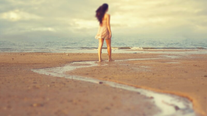 woman on beach at sunset
