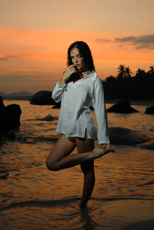 Woman on beach at sunset