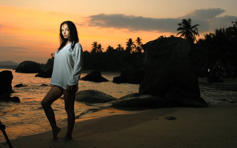 woman on beach at sunset