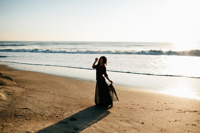 woman on beach at sunset