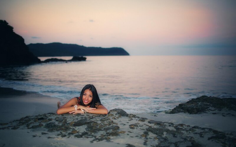 Woman on beach at sunset