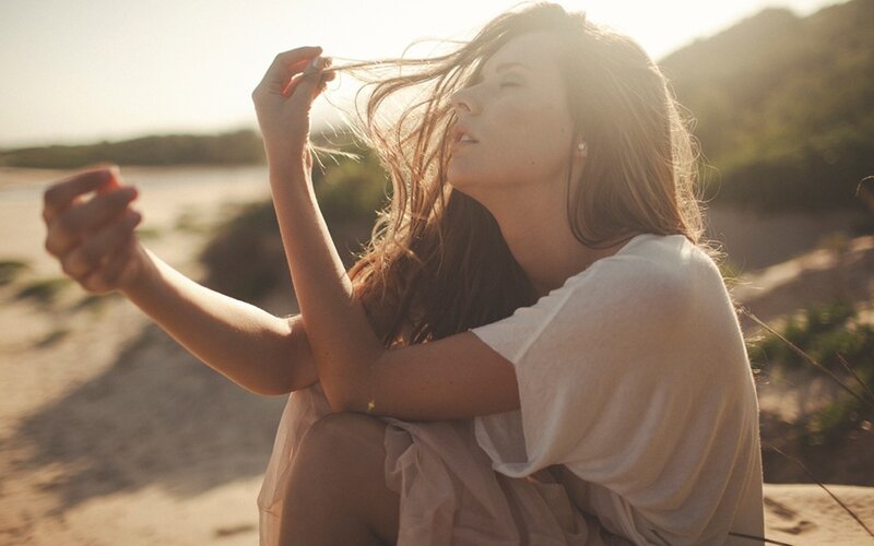 woman on beach at sunset