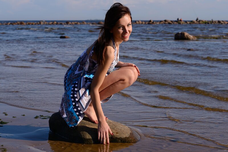 Woman on beach at sunset