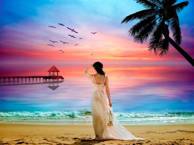 Woman on beach at sunset