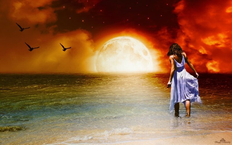 Woman on beach at sunset