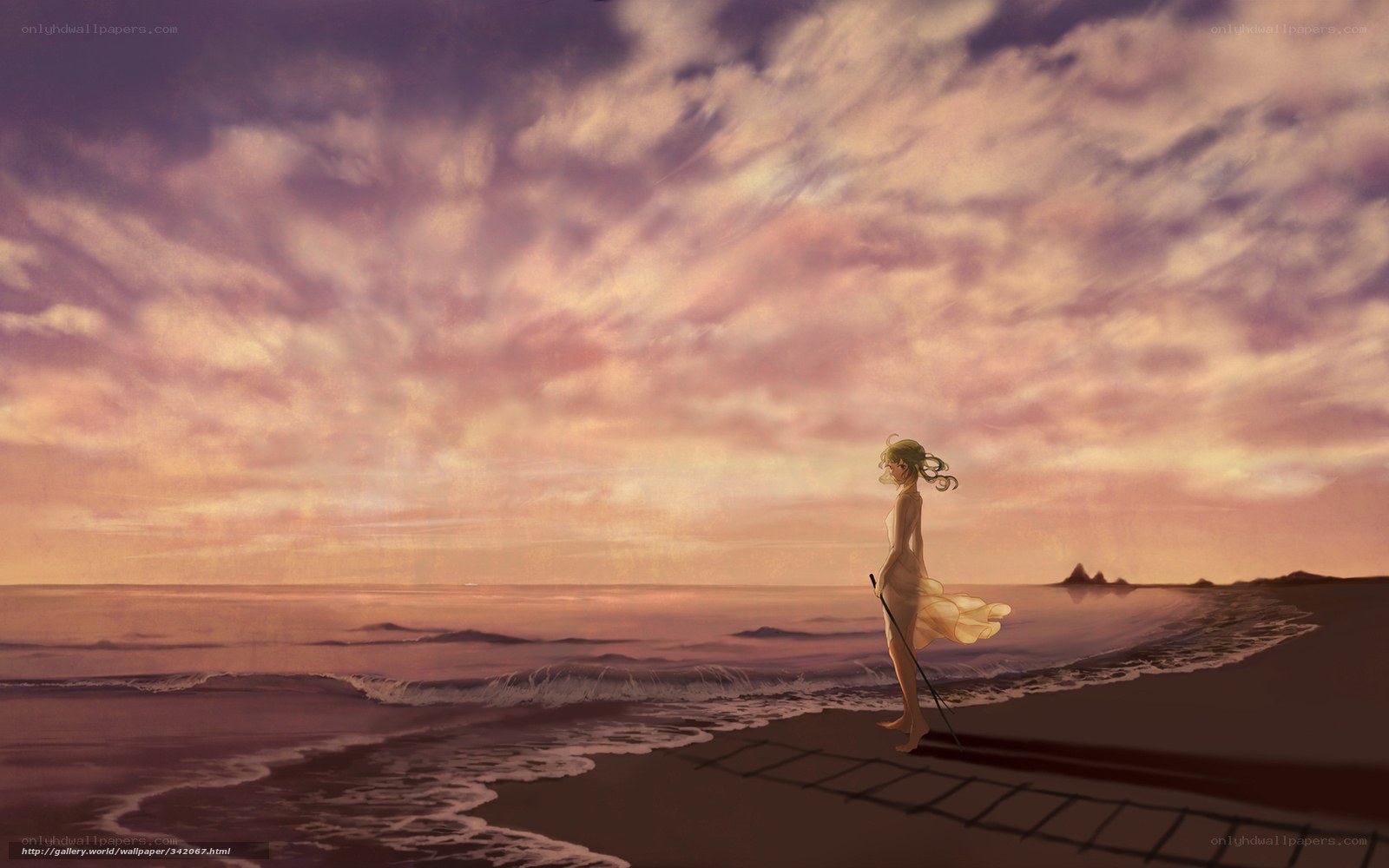 Woman on beach at sunset