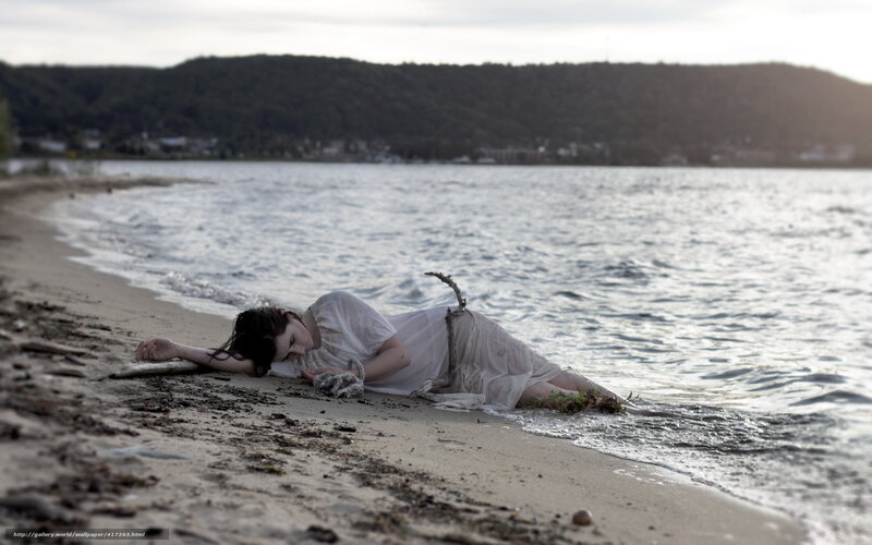 Woman on beach at sunset