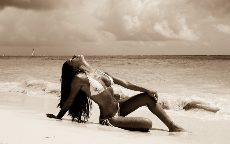 Woman on beach at sunset
