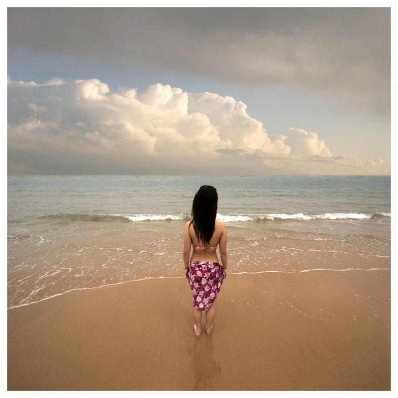 Woman on beach at sunset