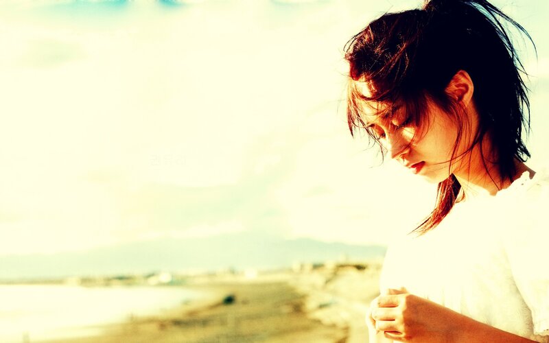 woman on beach at sunset